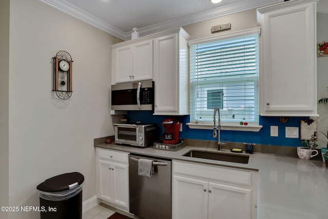 363 Latrobe Ave, Saint Augustine, FL 32095 - kitchen with appliances with stainless steel finishes, plenty of natural light, crown molding, and white cabinetry