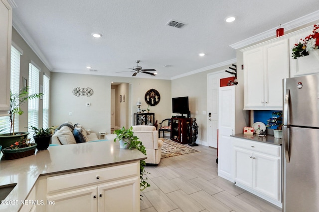 363 Latrobe Ave, Saint Augustine, FL 32095 - kitchen featuring freestanding refrigerator, open floor plan, a ceiling fan, recessed lighting, and a peninsula