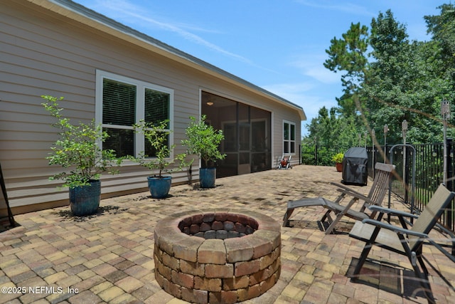 363 Latrobe Ave, Saint Augustine, FL 32095 - view of patio / terrace featuring an outdoor fire pit, a grill, and a sunroom