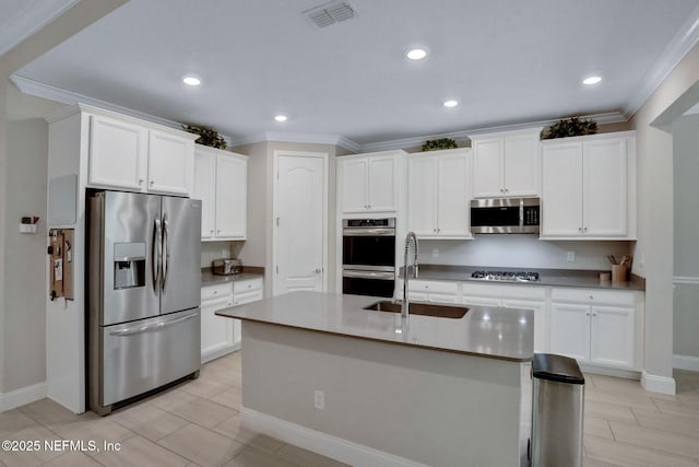 363 Latrobe Ave, Saint Augustine, FL 32095 - kitchen with appliances with stainless steel finishes, ornamental molding, white cabinetry, a center island with sink, and recessed lighting