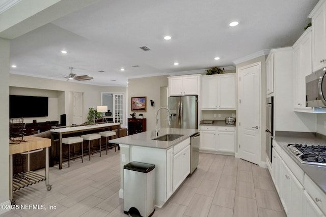 363 Latrobe Ave, Saint Augustine, FL 32095 - kitchen featuring stainless steel appliances, crown molding, recessed lighting, ceiling fan, and an island with sink