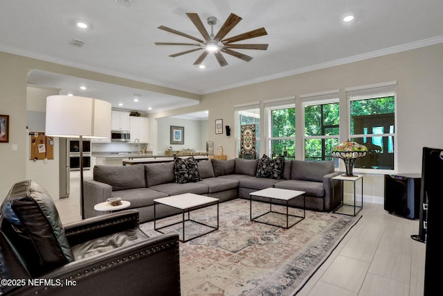 363 Latrobe Ave, Saint Augustine, FL 32095 - living area with a ceiling fan, ornamental molding, and recessed lighting
