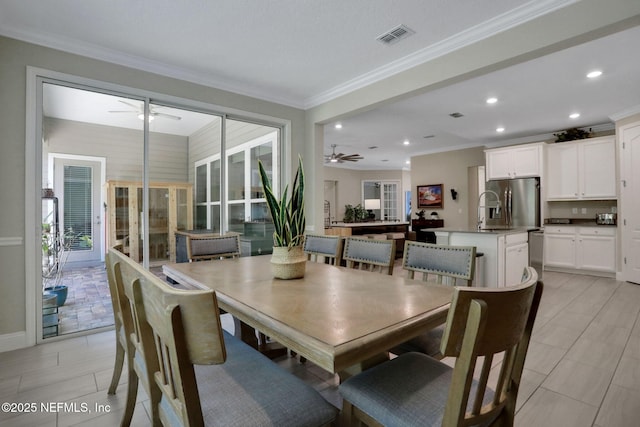 363 Latrobe Ave, Saint Augustine, FL 32095 - dining room featuring a ceiling fan, ornamental molding, recessed lighting, and healthy amount of natural light