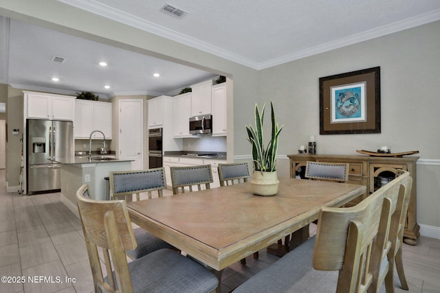 363 Latrobe Ave, Saint Augustine, FL 32095 - dining space featuring crown molding and recessed lighting