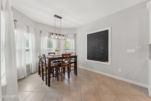 47 Mercutio Ln, Saint Augustine, FL 32092 - dining area featuring a chandelier and light tile patterned floors