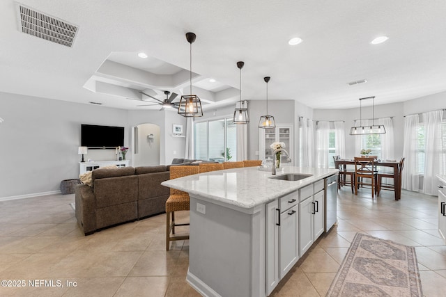 47 Mercutio Ln, Saint Augustine, FL 32092 - kitchen featuring light tile patterned floors, white cabinets, decorative light fixtures, recessed lighting, and light stone countertops