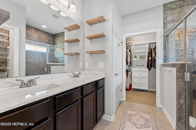 47 Mercutio Ln, Saint Augustine, FL 32092 - full bathroom with a shower stall, double vanity, tile patterned floors, and a spacious closet