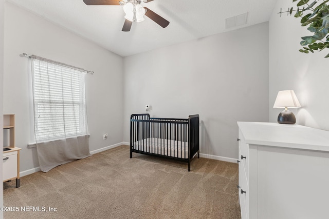47 Mercutio Ln, Saint Augustine, FL 32092 - bedroom featuring light carpet, a crib, and a ceiling fan