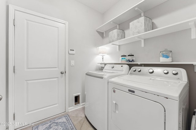47 Mercutio Ln, Saint Augustine, FL 32092 - washroom with independent washer and dryer and light tile patterned floors