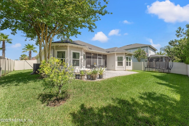 47 Mercutio Ln, Saint Augustine, FL 32092 - rear view of house featuring a sunroom, a patio area, a trampoline, and a fenced backyard