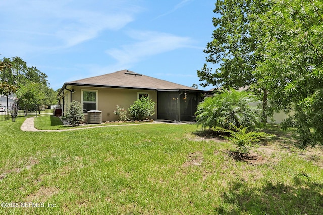 35 Root Ln, Saint Augustine, FL 32084 - rear view of house with a sunroom and stucco siding