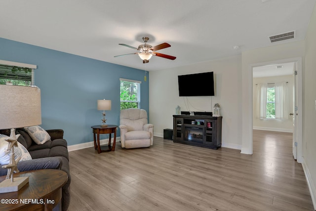 35 Root Ln, Saint Augustine, FL 32084 - living room featuring healthy amount of natural light, ceiling fan, and light wood-style flooring
