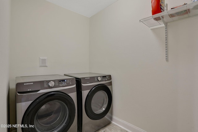 35 Root Ln, Saint Augustine, FL 32084 - laundry room with washer and clothes dryer and tile patterned floors