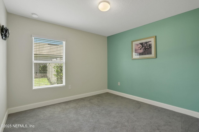 35 Root Ln, Saint Augustine, FL 32084 - spare room with plenty of natural light, a smoke detector, and carpet floors