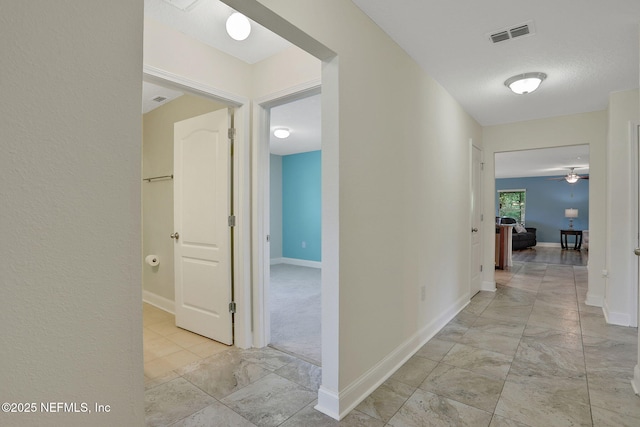 35 Root Ln, Saint Augustine, FL 32084 - hall featuring light marble finish floors and baseboards