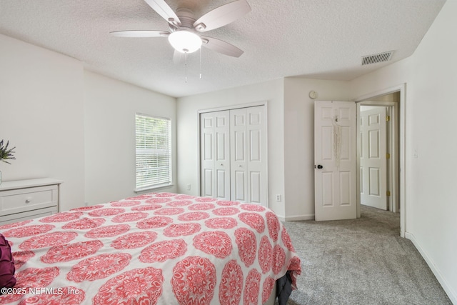 1083 Three Forks Ct, Saint Augustine, FL 32092 - carpeted bedroom featuring a textured ceiling, a closet, and a ceiling fan