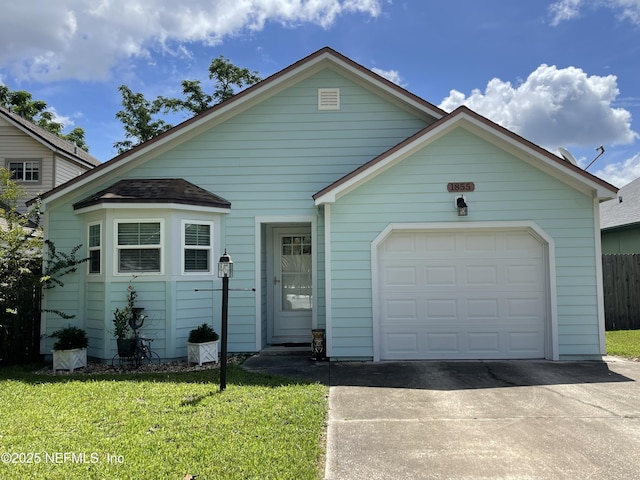 1855 N Alberta Ct, Middleburg, FL 32068 - view of front of property with concrete driveway, an attached garage, and a front lawn