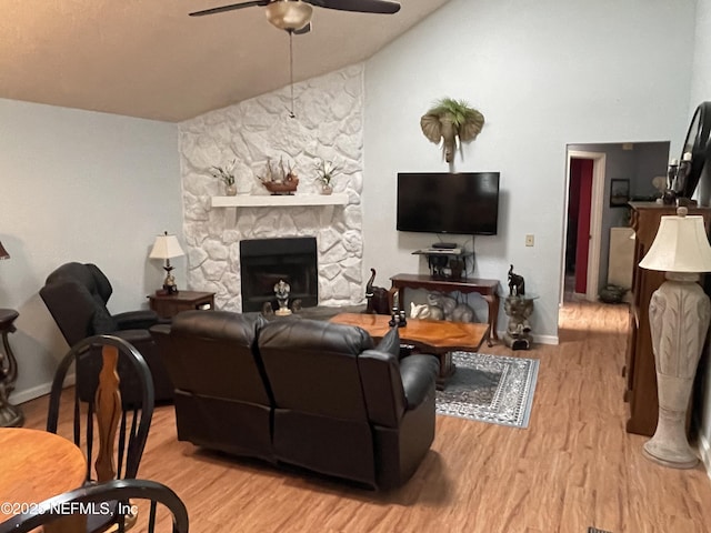 1855 N Alberta Ct, Middleburg, FL 32068 - living room featuring ceiling fan, vaulted ceiling, wood finished floors, and a fireplace