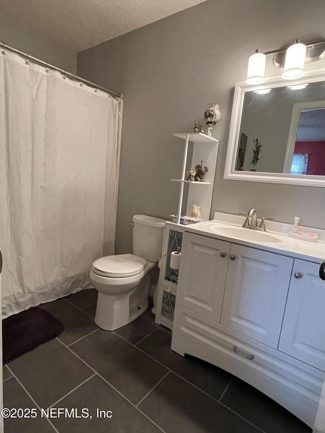 1855 N Alberta Ct, Middleburg, FL 32068 - bathroom with tile patterned flooring, vanity, a textured ceiling, and a shower with curtain