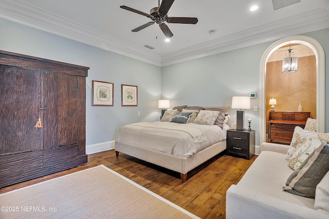 112 Harbourmaster Ct, Ponte Vedra Beach, FL 32082 - bedroom featuring wood finished floors, ornamental molding, arched walkways, a ceiling fan, and recessed lighting