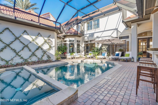 112 Harbourmaster Ct, Ponte Vedra Beach, FL 32082 - view of swimming pool with a pool with connected hot tub, a patio, and glass enclosure
