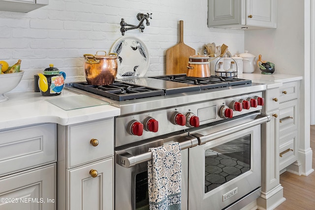 112 Harbourmaster Ct, Ponte Vedra Beach, FL 32082 - kitchen view of designer range, light countertops, and light wood-type flooring