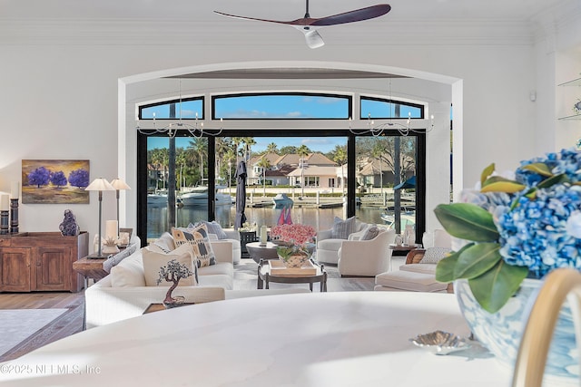 112 Harbourmaster Ct, Ponte Vedra Beach, FL 32082 - living room featuring wood finished floors, crown molding, a water view, and a ceiling fan