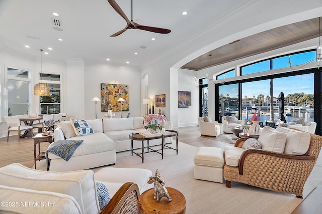 112 Harbourmaster Ct, Ponte Vedra Beach, FL 32082 - living area with a ceiling fan, arched walkways, recessed lighting, light wood-style floors, and crown molding