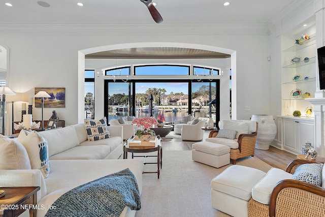112 Harbourmaster Ct, Ponte Vedra Beach, FL 32082 - living room with light wood-style floors, built in features, crown molding, arched walkways, and recessed lighting
