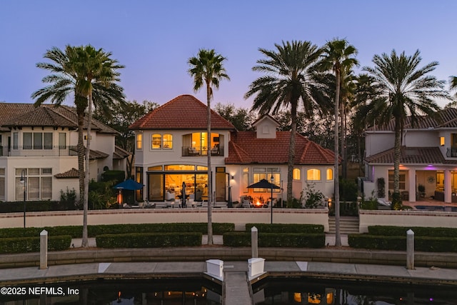 112 Harbourmaster Ct, Ponte Vedra Beach, FL 32082 - rear view of house with stucco siding and a tile roof