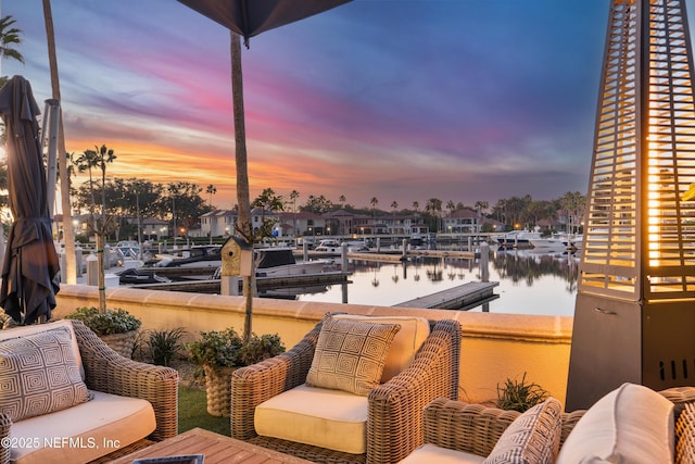 112 Harbourmaster Ct, Ponte Vedra Beach, FL 32082 - deck at dusk with a water view and a boat dock