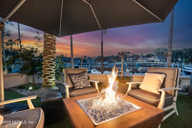 112 Harbourmaster Ct, Ponte Vedra Beach, FL 32082 - patio terrace at dusk with an outdoor fire pit