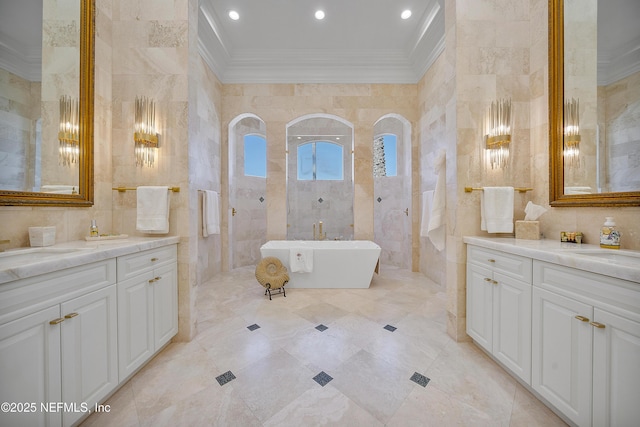 112 Harbourmaster Ct, Ponte Vedra Beach, FL 32082 - full bath featuring crown molding, tile walls, two vanities, a soaking tub, and recessed lighting