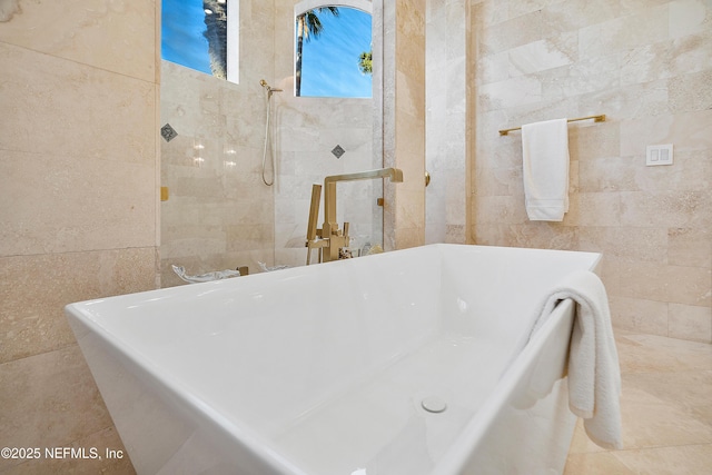 112 Harbourmaster Ct, Ponte Vedra Beach, FL 32082 - full bathroom featuring tile walls, a freestanding bath, and tiled shower