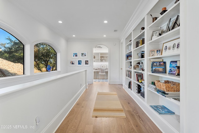 112 Harbourmaster Ct, Ponte Vedra Beach, FL 32082 - hall with crown molding, light wood-style flooring, recessed lighting, built in features, and arched walkways