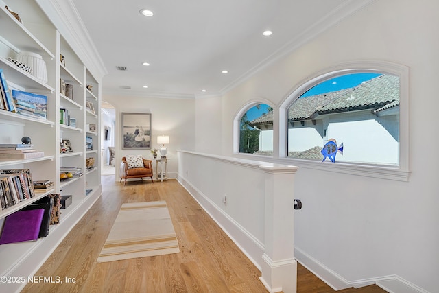 112 Harbourmaster Ct, Ponte Vedra Beach, FL 32082 - hallway with light wood-type flooring, ornamental molding, recessed lighting, and built in features