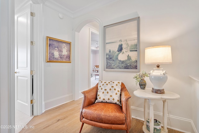112 Harbourmaster Ct, Ponte Vedra Beach, FL 32082 - sitting room with arched walkways, light wood-type flooring, and ornamental molding