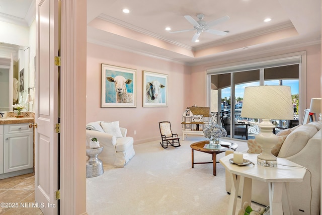 112 Harbourmaster Ct, Ponte Vedra Beach, FL 32082 - living room featuring a tray ceiling, a ceiling fan, ornamental molding, recessed lighting, and light carpet