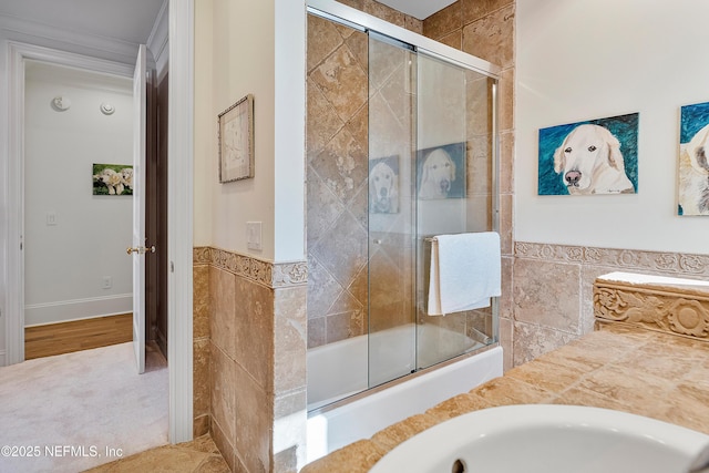 112 Harbourmaster Ct, Ponte Vedra Beach, FL 32082 - full bath with tile walls, a tile shower, wainscoting, and a bath