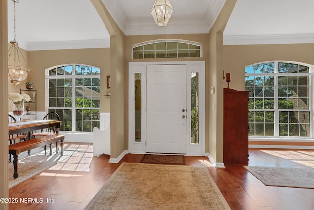 1685 Pinecrest Dr, Fleming Island, FL 32003 - foyer entrance featuring a chandelier, hardwood / wood-style floors, and ornamental molding