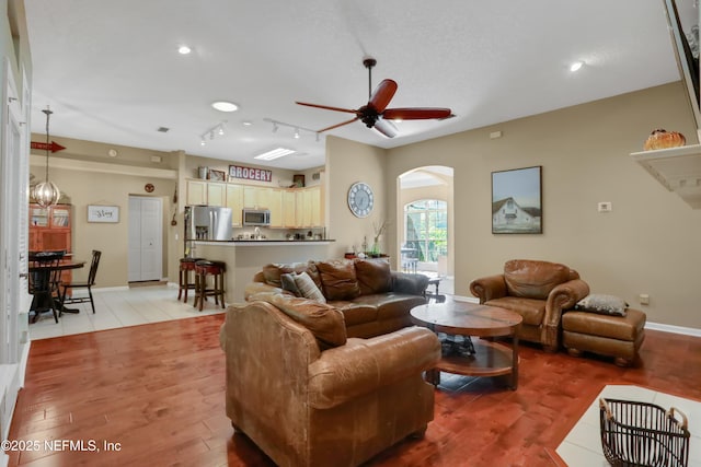 1685 Pinecrest Dr, Fleming Island, FL 32003 - living area with arched walkways, a ceiling fan, light wood-type flooring, and recessed lighting