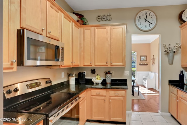 1685 Pinecrest Dr, Fleming Island, FL 32003 - kitchen with stainless steel appliances, light brown cabinetry, and light tile patterned floors