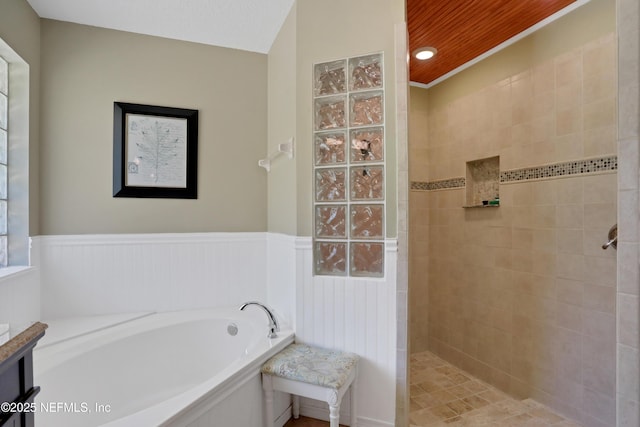 1685 Pinecrest Dr, Fleming Island, FL 32003 - bathroom with a bath, walk in shower, and wainscoting