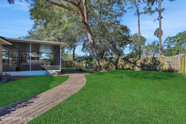 1685 Pinecrest Dr, Fleming Island, FL 32003 - fenced backyard with a sunroom and a ceiling fan