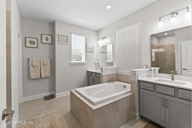 902 Orange Branch Trl, Saint Johns, FL 32259 - full bathroom with a garden tub, two vanities, a tile shower, and tile patterned floors