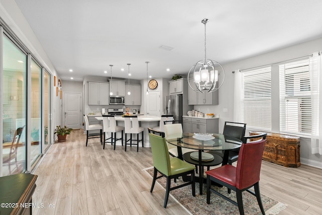 902 Orange Branch Trl, Saint Johns, FL 32259 - dining area with light wood finished floors, a chandelier, and recessed lighting