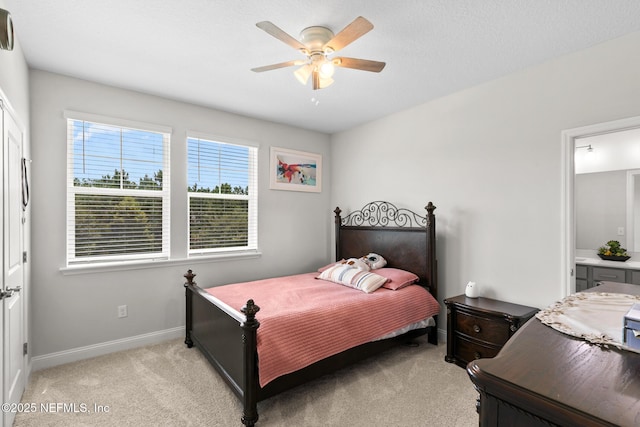 902 Orange Branch Trl, Saint Johns, FL 32259 - bedroom with light colored carpet, ensuite bath, and a ceiling fan