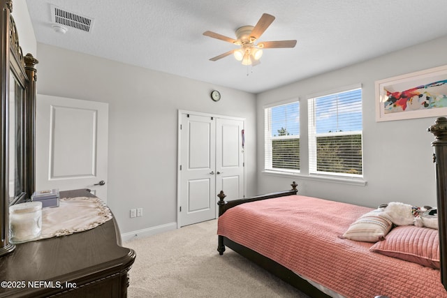 902 Orange Branch Trl, Saint Johns, FL 32259 - bedroom featuring light carpet, a closet, ceiling fan, and a textured ceiling