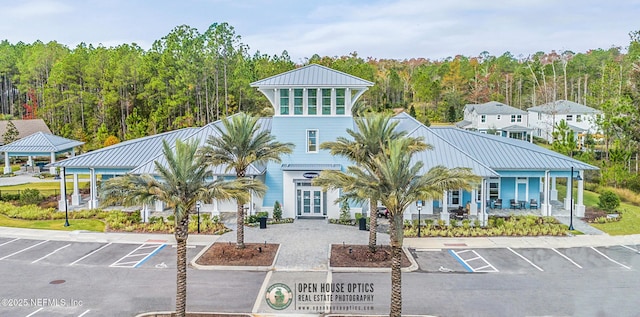 902 Orange Branch Trl, Saint Johns, FL 32259 - view of building exterior featuring uncovered parking and a wooded view