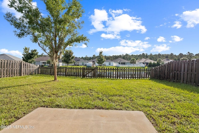 95886 Graylon Dr, Yulee, FL 32097 - fenced backyard with a residential view and a patio area